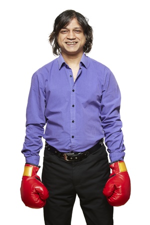 Man wearing boxing gloves smiling on white backgroundの写真素材