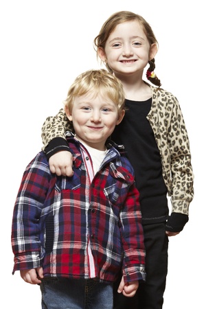 Young boy and girl smiling on white backgroundの写真素材