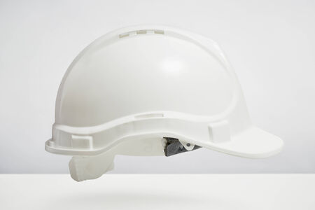 Builders hard hat isolated on white background. DIY protection and safety conceptの写真素材