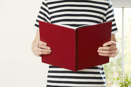 Male hands holding book with empty copy space. Student education conceptの写真素材