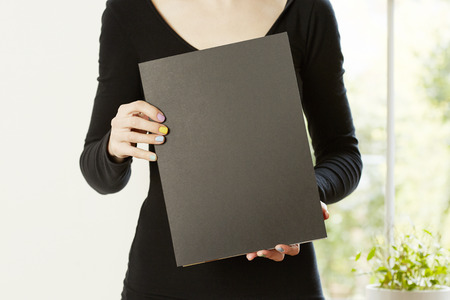 Female hands holding book with empty copy space. Student education conceptの写真素材