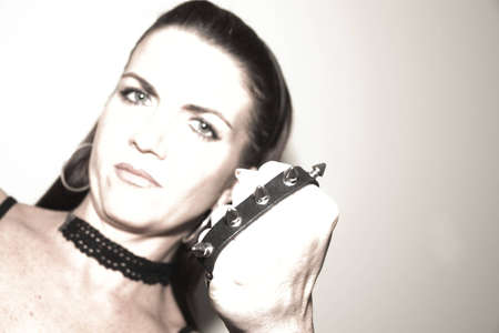 A female wearing a knuckle dusterの写真素材