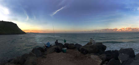 Fishermen on Seaway At Dusk, QLD, Australiaの写真素材