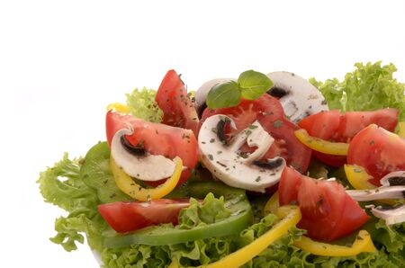 Simple salad in white bowl close up isolated, on white backgroundの写真素材