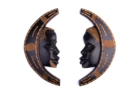 carved african wooden wall decoration, man and woman, looking at each other, isolated on white white backgroundの写真素材