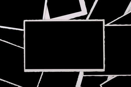 old phot frames stapeld, superposingly and empty, black interiorの写真素材