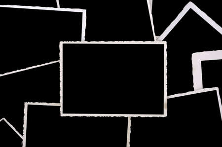 old phot frames stapeld, superposingly and empty, black interiorの写真素材