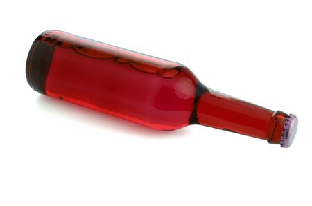 Red bottle with liquid, isolated on white backgroundの写真素材