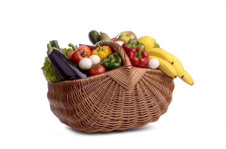 Freisteller shopping basket carrying different fruits and vegetables, white background, cutoutの写真素材