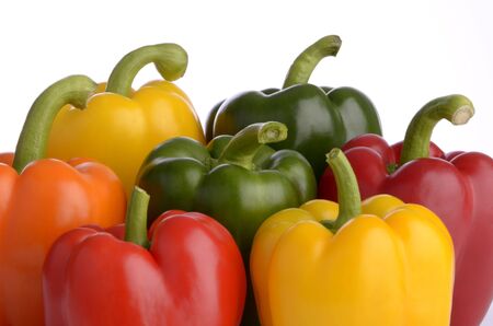 seven sweet pepper fruits of different color, isolated, white background, close upの写真素材
