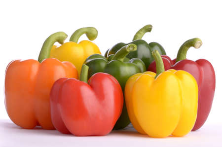 seven sweet pepper fruits of different color, isolated, white backgroundの写真素材