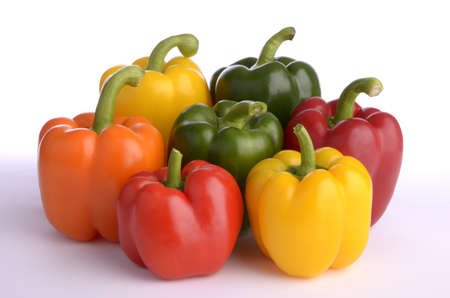 seven sweet pepper fruits of different color, isolated, white backgroundの写真素材