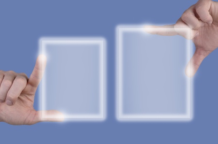 two hands describe   touch a screen   touchscreen before light blue backgroundの写真素材