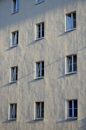 Facade of a building with several windows, sidelight, outdoor