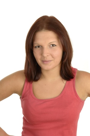 Young pretty woman in pink top smiling against white background, isolated, portraitの写真素材