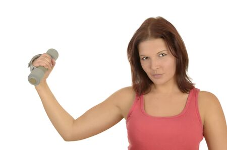 Portrait of a young woman during power training in pink top on White Backgroundの写真素材