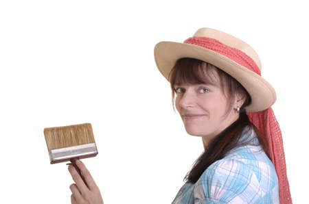 Young artist is holding  brush and smiles into camera, isolated, white backgroundの写真素材