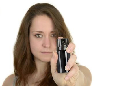 young woman shows open hand before white background, idolated, studio shotの写真素材