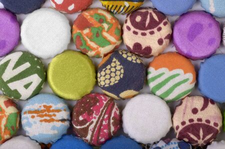 African bottle caps covered with cloth, studio shot