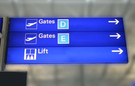 Blue Gates Sign at Airport, indicating to the right