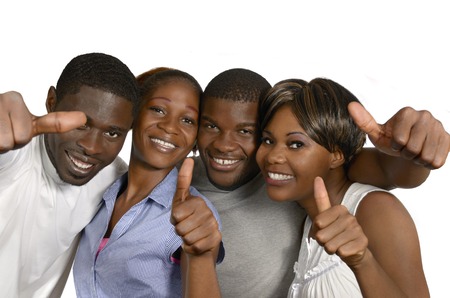 Four african friends showing thumbs up, Studio Shotの写真素材