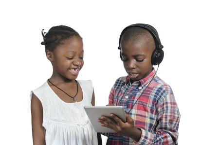 Two african kids with Tablet PC, Studio Shotの写真素材