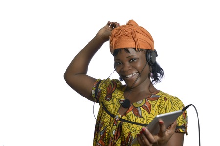 African woman listening music with tablet PC, Studio Shotの写真素材