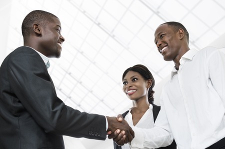 Three african business people handshake, Studio Shot, Cameroonの写真素材