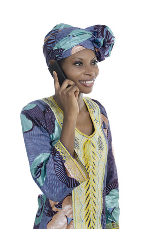 Traditional african woman talking with smart phone, Studio Shotの写真素材