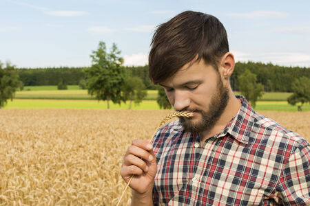Young farmer inspecting crop, Outdoor Shot