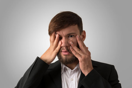 Clueless young man, studio shotの写真素材