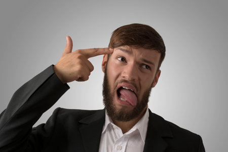 Clueless young man, studio shotの写真素材