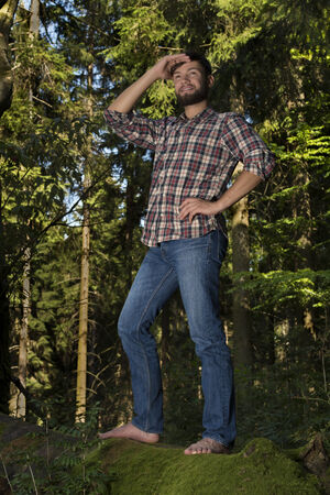 Young adventurer celebrating nature, outdoor shotの写真素材