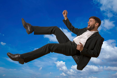 Falling Man in Sky, studio shotの写真素材