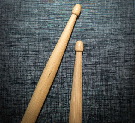 Wood Drumsticks isolated on black texture backgroundの写真素材