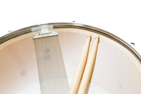 Wood snare drum and drumsticks isolated in white backgroundの写真素材