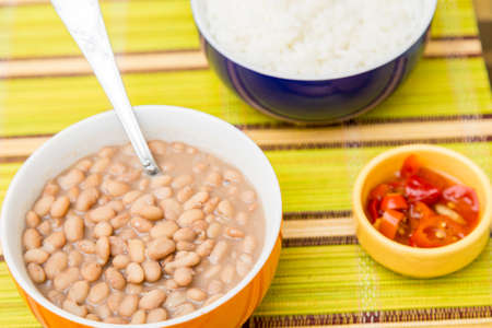 Baked beans on the table with texture. This brazilian beans it's known as Carioquinha.の写真素材