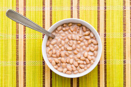 Baked beans on the table with texture. This brazilian beans it's known as Carioquinha.の写真素材