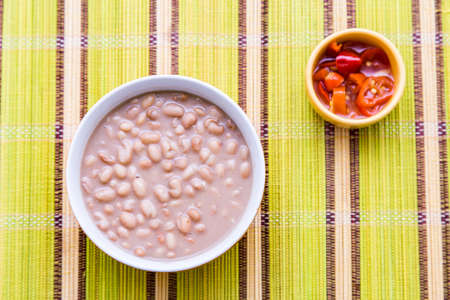 Baked beans on the table with texture. This brazilian beans it's known as Carioquinha.の写真素材