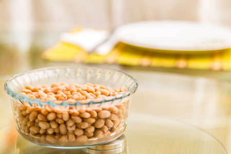 Baked beans on the table with texture. This brazilian beans it's known as Carioquinha.の写真素材