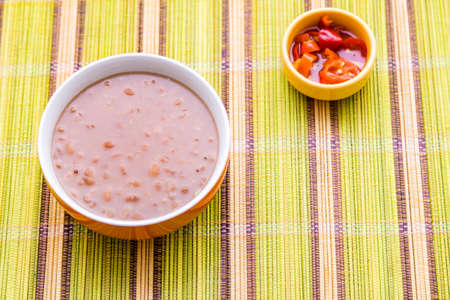 Baked beans on the table with texture. This brazilian beans it's known as Carioquinha.の写真素材
