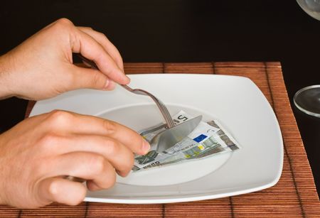 hands eating Euro on the empty plate