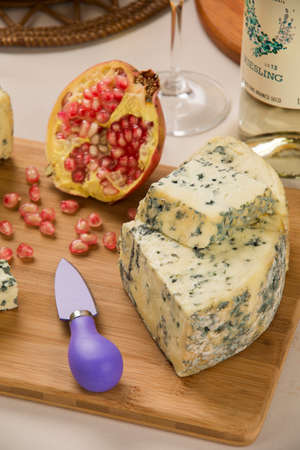 Blue cheese on wooden background, delicious foodの写真素材
