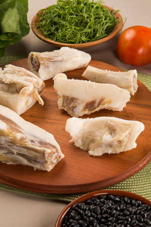 Raw pig tails on wooden backgroundの写真素材