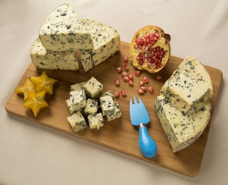 Blue cheese on wooden background, delicious foodの写真素材