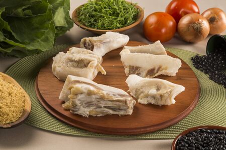 Raw pig tails on wooden backgroundの写真素材
