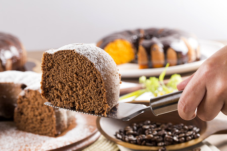 Chocolate cake on the table with carrot cake in the background.の写真素材