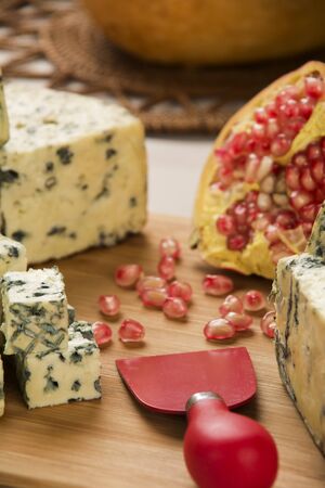 Blue cheese on wooden background, delicious foodの写真素材