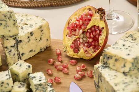 Blue cheese on wooden background, delicious foodの写真素材