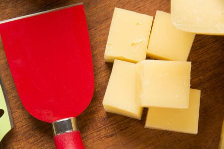 Different cheeses on a cutting board, delicious foodの写真素材